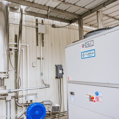 Industrial processing equipment, likely part of a spray drying system or a larger industrial drying solution, featuring stainless steel components and advanced climate control units from http://pulsedry.com/.