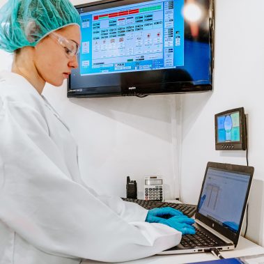 A technician operating the advanced control panel of a Pulse Combustion spray drying system, monitoring the industrial drying process for optimal quality.