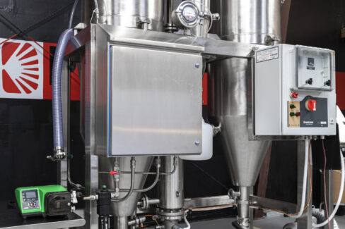 A complete Pulse Combustion spray drying system featuring stainless steel cyclones, integrated control panels, and a precision feed pump—a comprehensive industrial drying solution.