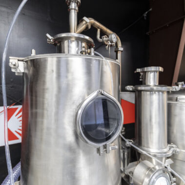 Detailed view of a stainless steel industrial spray dryer, showcasing the robust construction of our spray drying equipment and systems.