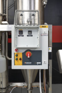 The control panel of a Pulse Combustion Systems industrial spray dryer, showing precise temperature controls for an efficient drying system.