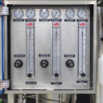 Precision control panel for a Pulse Combustion Systems industrial spray dryer, showing regulators and gauges for a complete spray drying system.