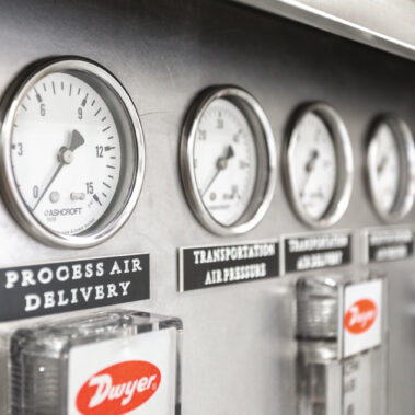 Precision control panel of a Pulse Combustion spray dryer system, showing gauges for monitoring process air delivery and ensuring optimal performance of the industrial drying solution.