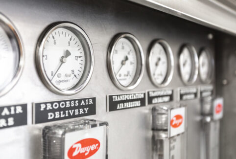 Precision control panel of a Pulse Combustion spray dryer system, showing gauges for monitoring process air delivery and ensuring optimal performance of the industrial drying solution.