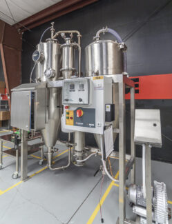 A complete industrial spray dryer system from Pulse Combustion Systems, showcasing the stainless steel construction and advanced controls of our spray drying equipment.