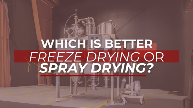 FEATURE IMAGES (6) Industrial spray drying equipment inside a manufacturing facility with large metal vessels and pipes. The foreground features a bold headline overlay in white and red text: “Which is better: Freeze Drying or Spray Drying?”—visually highlighting a key processing equipment comparison topic.