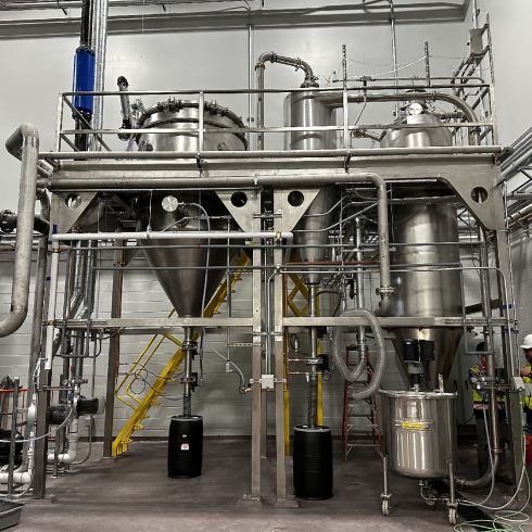 A complete view of the P-50 industrial spray dryer during installation, showcasing a comprehensive spray drying system engineered for high-volume production.