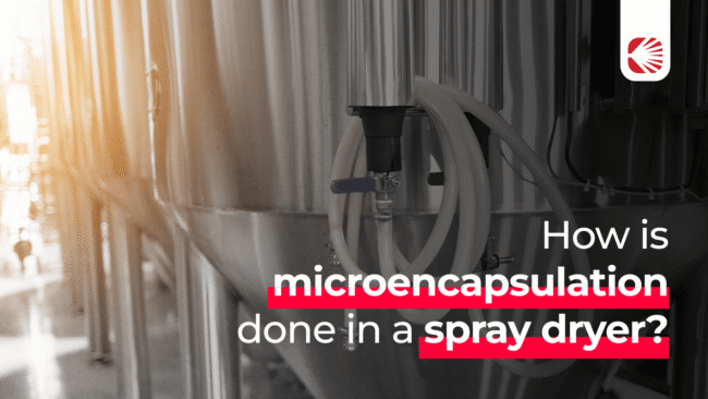 How is microencapsulation done in a spray dryer?