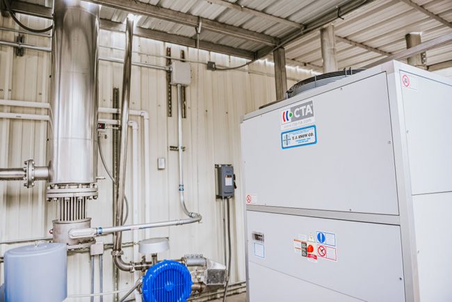 An industrial spray dryer system with its pulse combustion system installed in a facility, showcasing the advanced spray drying equipment manufactured by http://pulsedry.com/.